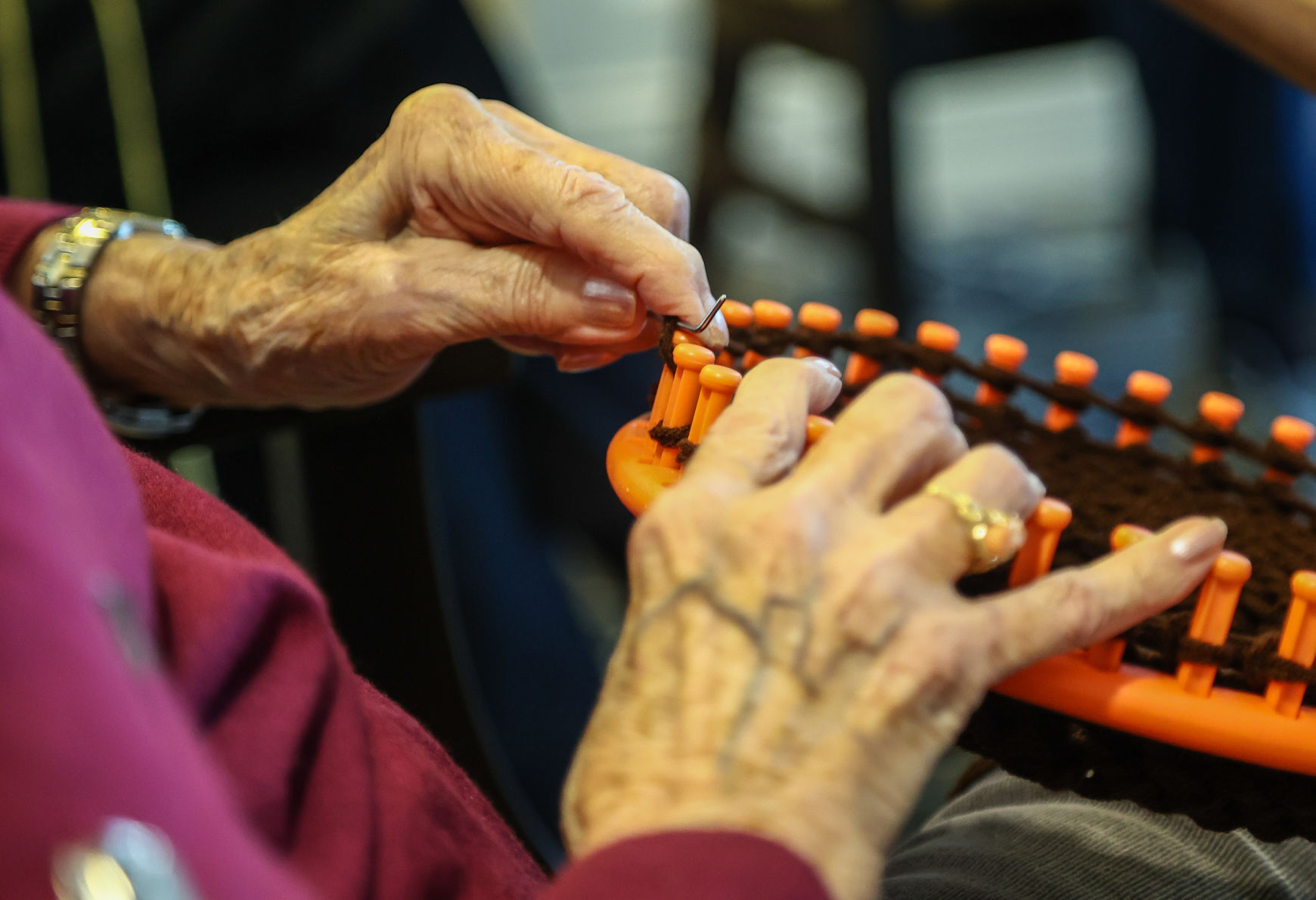 Seniors use looms to create items for charities